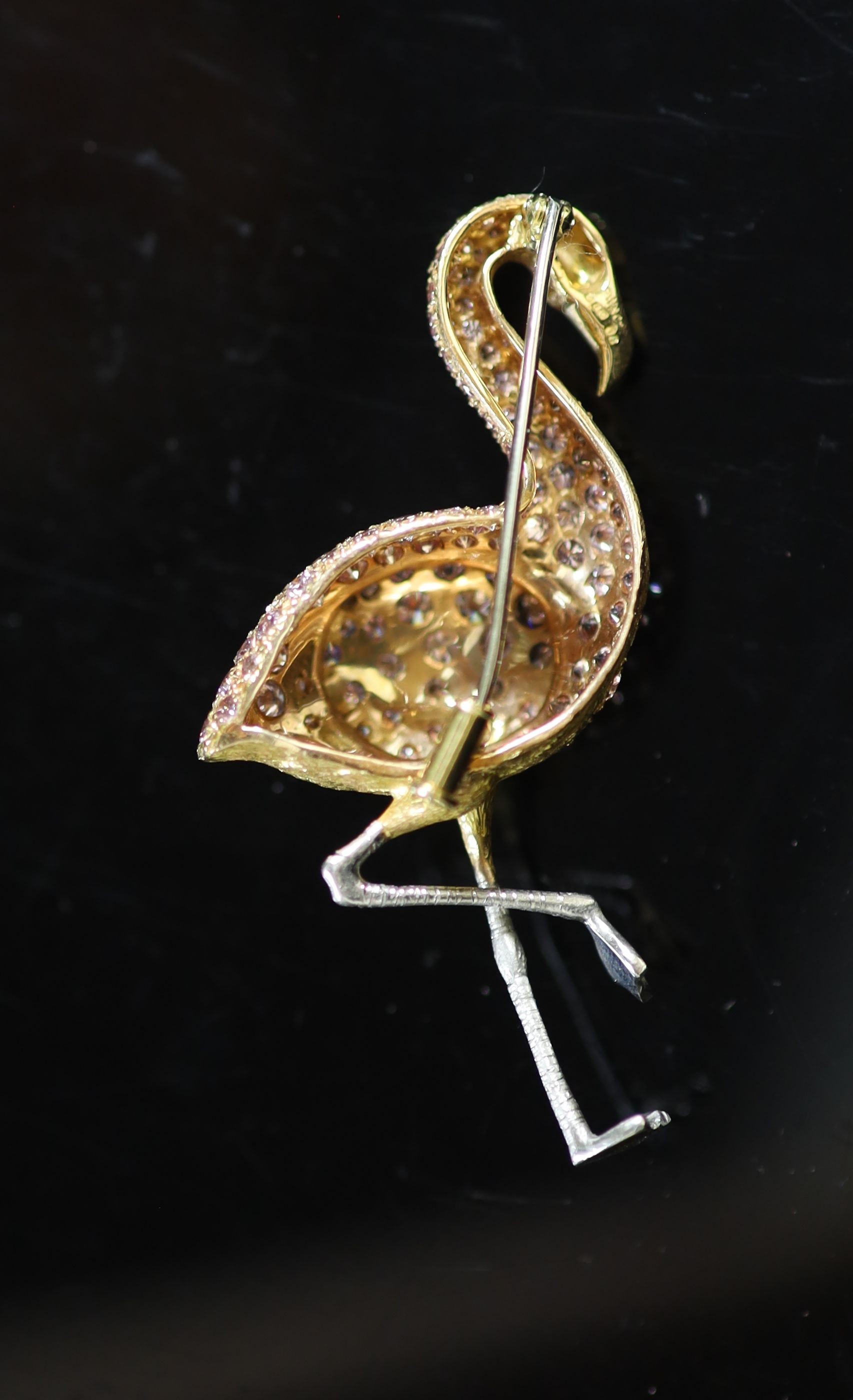 A modern two colour 18ct gold and diamond encrusted brooch, modelled as a flamingo